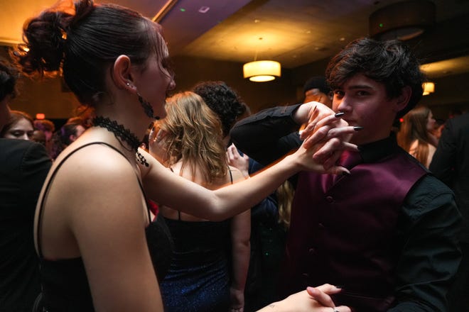 Seniors Adam Henderson, right, and Amy Haselhorst, left, dance at the Round Rock High School Prom at the Sheraton Austin and Georgetown hotel on Saturday, April 27, 2024 in Georgetown, Texas.