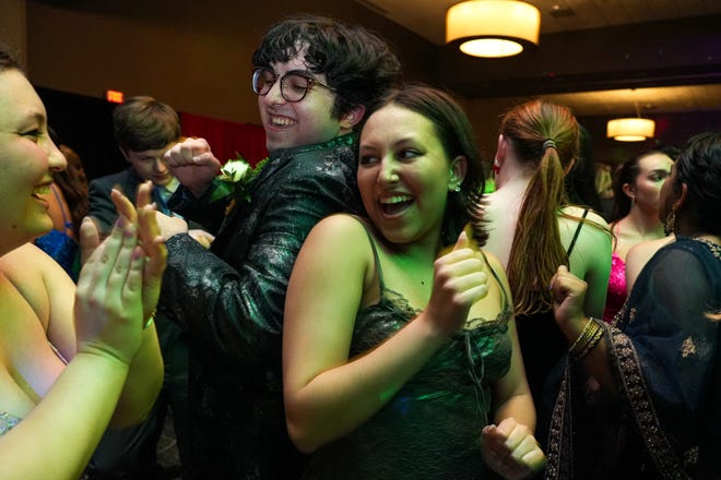 Grace Nelson, right, and Chris Ramshaw, left, dance at the Round Rock High School Prom at the Sheraton Austin and Georgetown hotel on Saturday, April 27, 2024 in Georgetown, Texas.